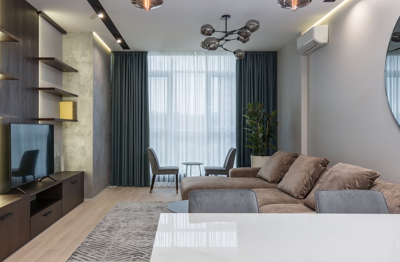 Open-plan Dubai office with neutral-toned carpet tiles and modern workstations
